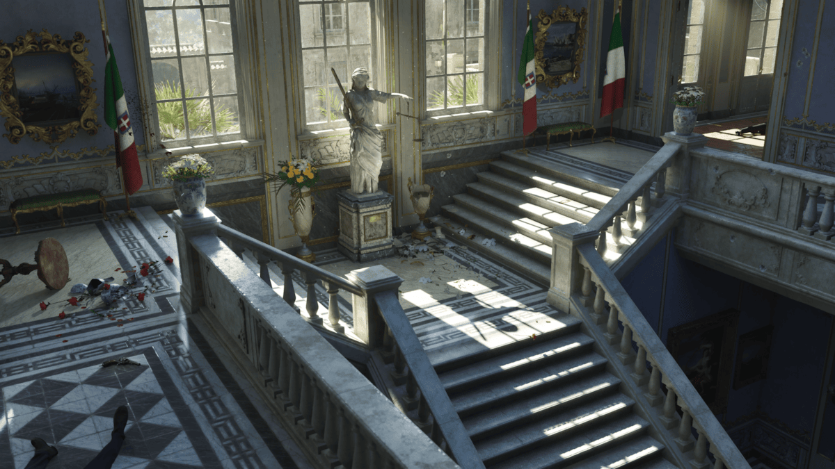 A sunlit interior staircase in Mafia The Old Country